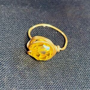 Gold Wire Ring with Yellow Faceted Gem